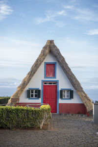 Exterior of house and building against sky