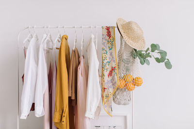 Close-up of multi colored umbrellas hanging on rack