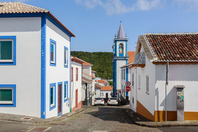 Exterior of houses and buildings against blue sky