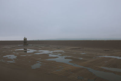 Scenic view of beach against clear sky