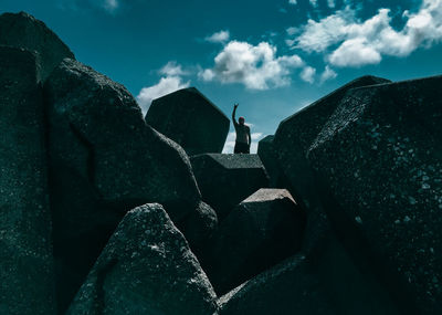 Silhouette man in mountains against sky