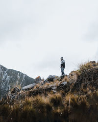 Man on field against sky