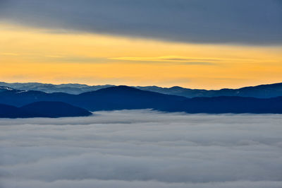 Scenic view of cloudscape and mountains