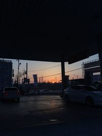 City street against sky during sunset