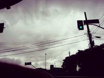 Low angle view of road against cloudy sky