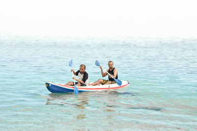 People on boat in sea