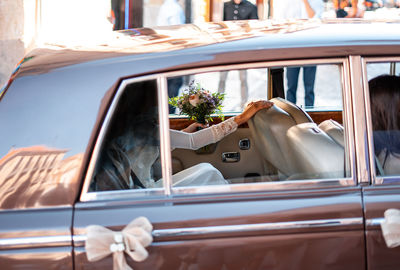 Bride sitting in car