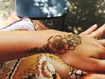Close-up of man holding flower