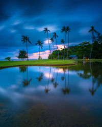 Scenic view of lake against sky at dusk