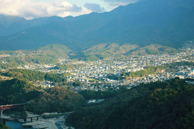 High angle view of townscape against mountains