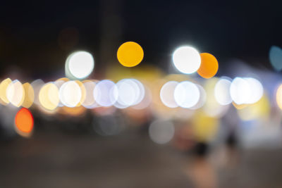 Abstract bokeh night garden in city background, abstract colorful defocused circular facula