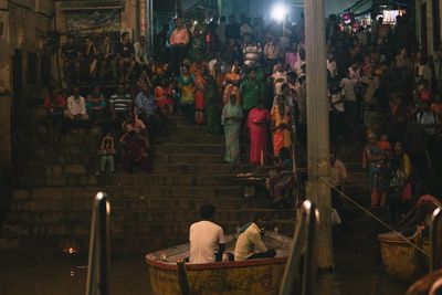 Group of people in market at night