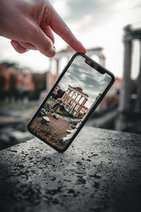 Close-up of hand photographing