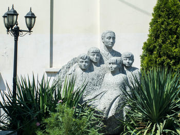 Statue against trees