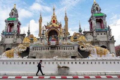 Statue of temple against building