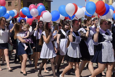 Group of people on balloons