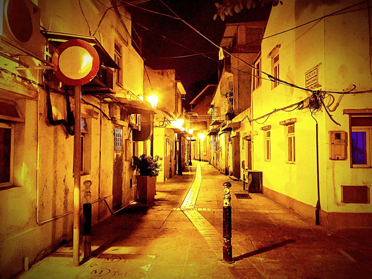 EMPTY ALLEY ALONG BUILDINGS