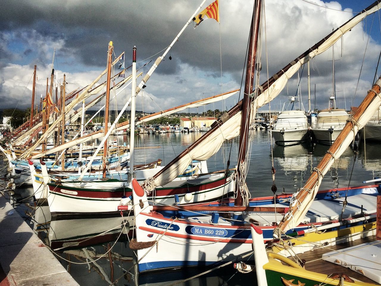 nautical vessel, transportation, moored, boat, mode of transport, water, sky, cloud - sky, sea, harbor, mast, cloudy, cloud, sailboat, travel, rope, day, outdoors, marina, nature