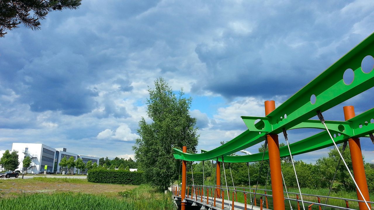 sky, grass, cloud - sky, tree, cloudy, field, tranquility, grassy, bench, nature, landscape, fence, cloud, tranquil scene, railing, green color, growth, scenics, beauty in nature, wood - material