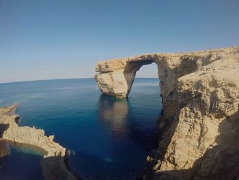 Scenic view of sea against clear blue sky