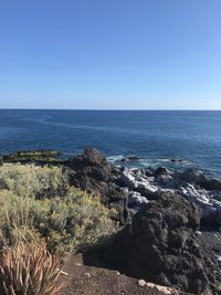 Scenic view of sea against clear sky