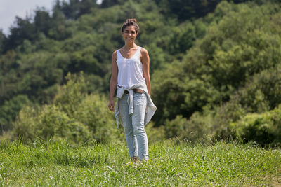 Full length of man standing on grassy field