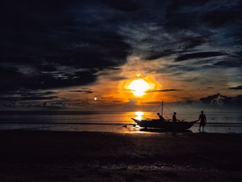 Scenic view of sea against sky at sunset