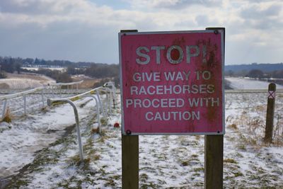 Information sign on snow covered land