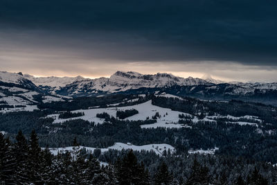 Scenic view of mountains against sky during winter