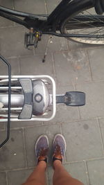 Low section of people standing on railroad station platform