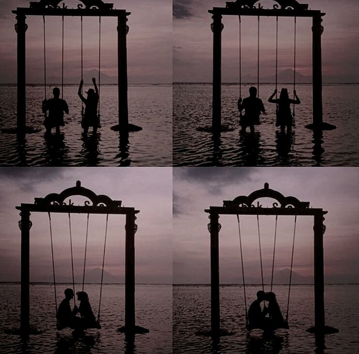 SILHOUETTE OF PEOPLE OVERLOOKING CALM SEA