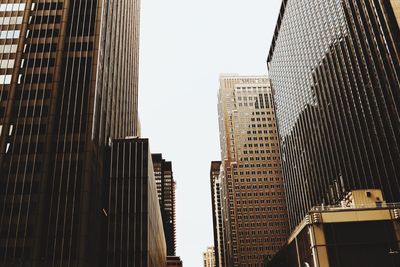 Low angle view of buildings in city against sky