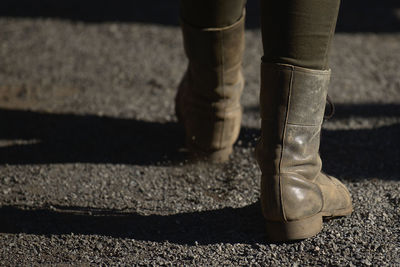 Low section of person standing on street