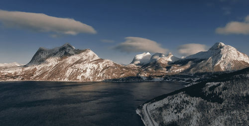 Scenic view of snowcapped mountains against sky