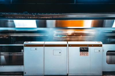 Blurred motion of train at railroad station