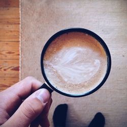 Cropped image of hand holding drink