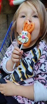 Portrait of cute girl with lollipop