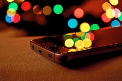 Close-up of illuminated lighting equipment on table