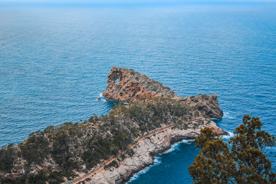 High angle view of rock formation in sea