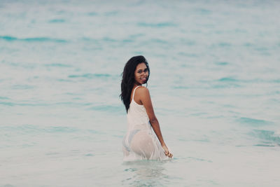 Happy young woman in the sea