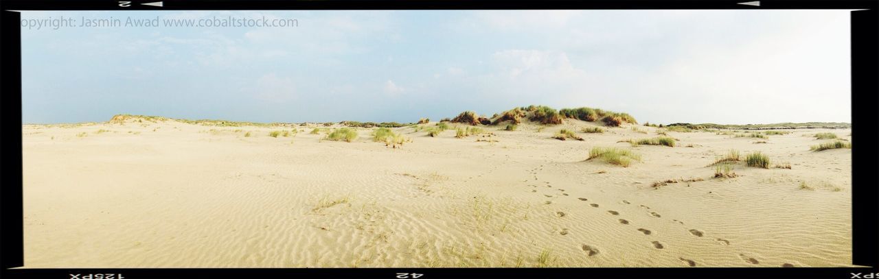 transfer print, auto post production filter, sand, beach, tranquil scene, tranquility, sky, scenics, nature, shore, beauty in nature, sea, water, landscape, outdoors, day, no people, remote, non-urban scene, coastline