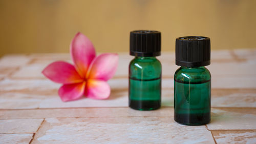 Close-up of multi colored bottles on table