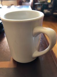 Close-up of coffee cup on table