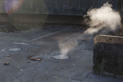 High angle view of smoke emitting from car on street