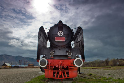 Train on railroad track against sky