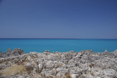 Scenic view of sea against clear blue sky