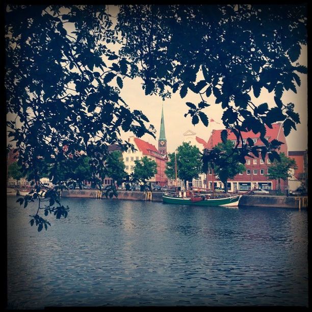 transfer print, tree, water, auto post production filter, waterfront, building exterior, built structure, architecture, branch, lake, river, sky, nature, nautical vessel, growth, day, boat, tranquility, outdoors, reflection