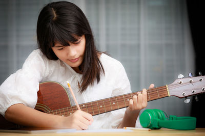 Girl playing guitar