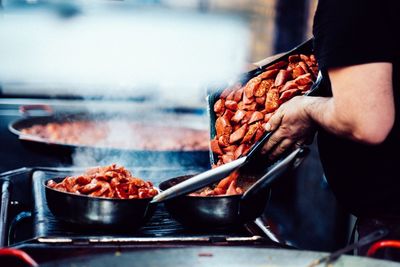 Close-up of man preparing food in kitchen