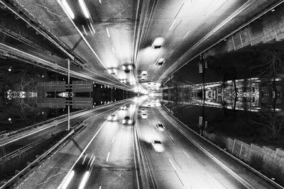 Light trails on road in city at night